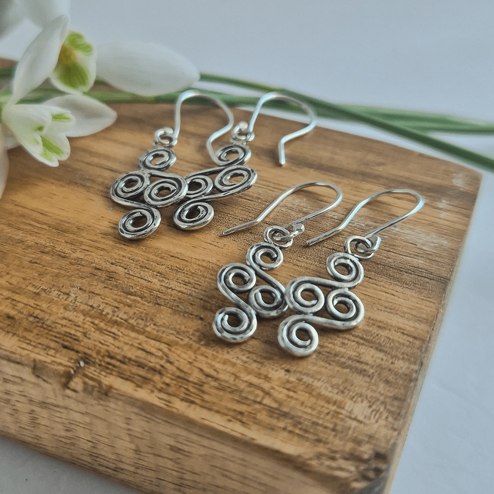 Closeup photo showing the details in the double-ended spiral earrings.