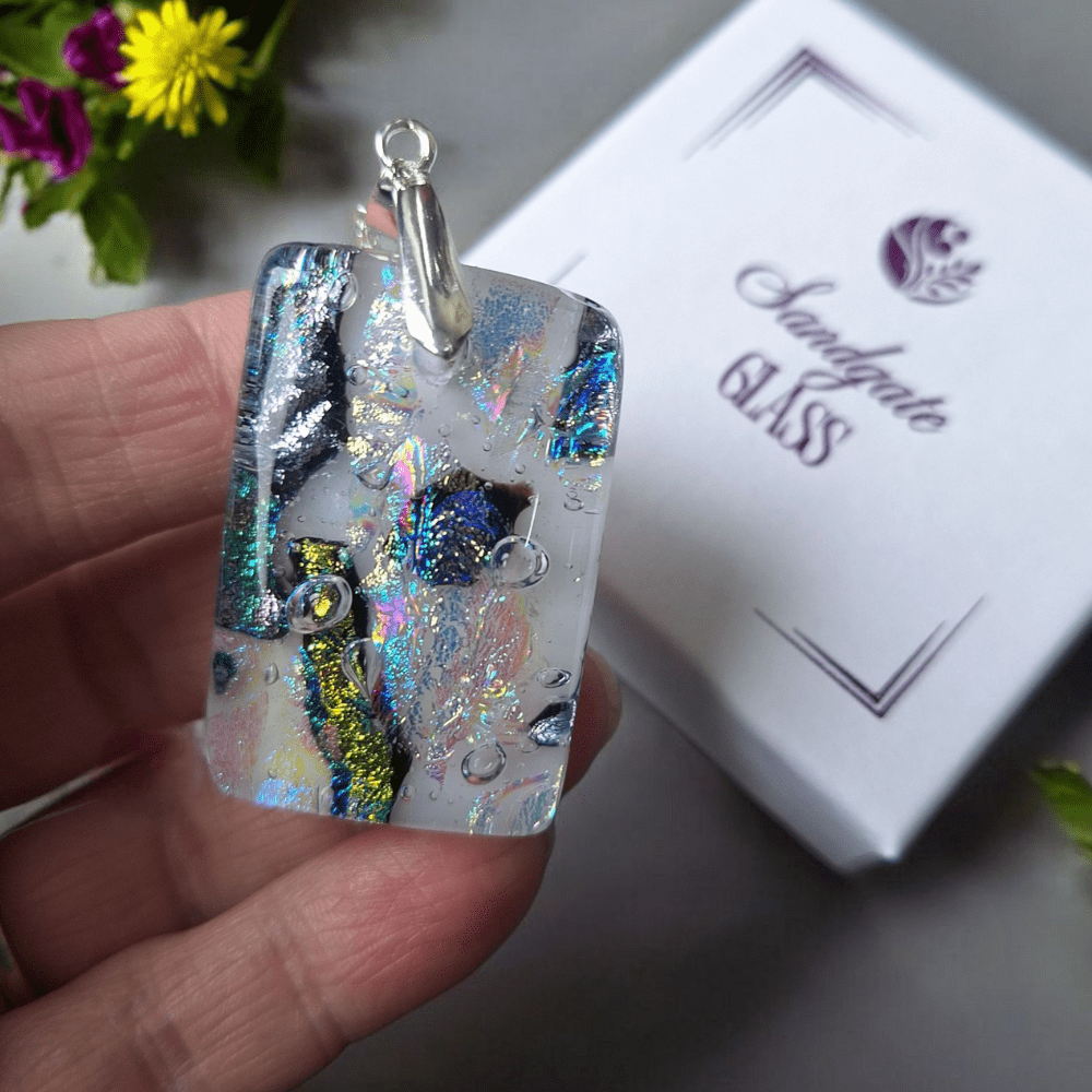 Handmade dichroic fused glass pendant with iridescent shimmer on a white base, silver-plated bail and chain, artisan necklace gift for her, perfect for birthday, summer or anniversary.