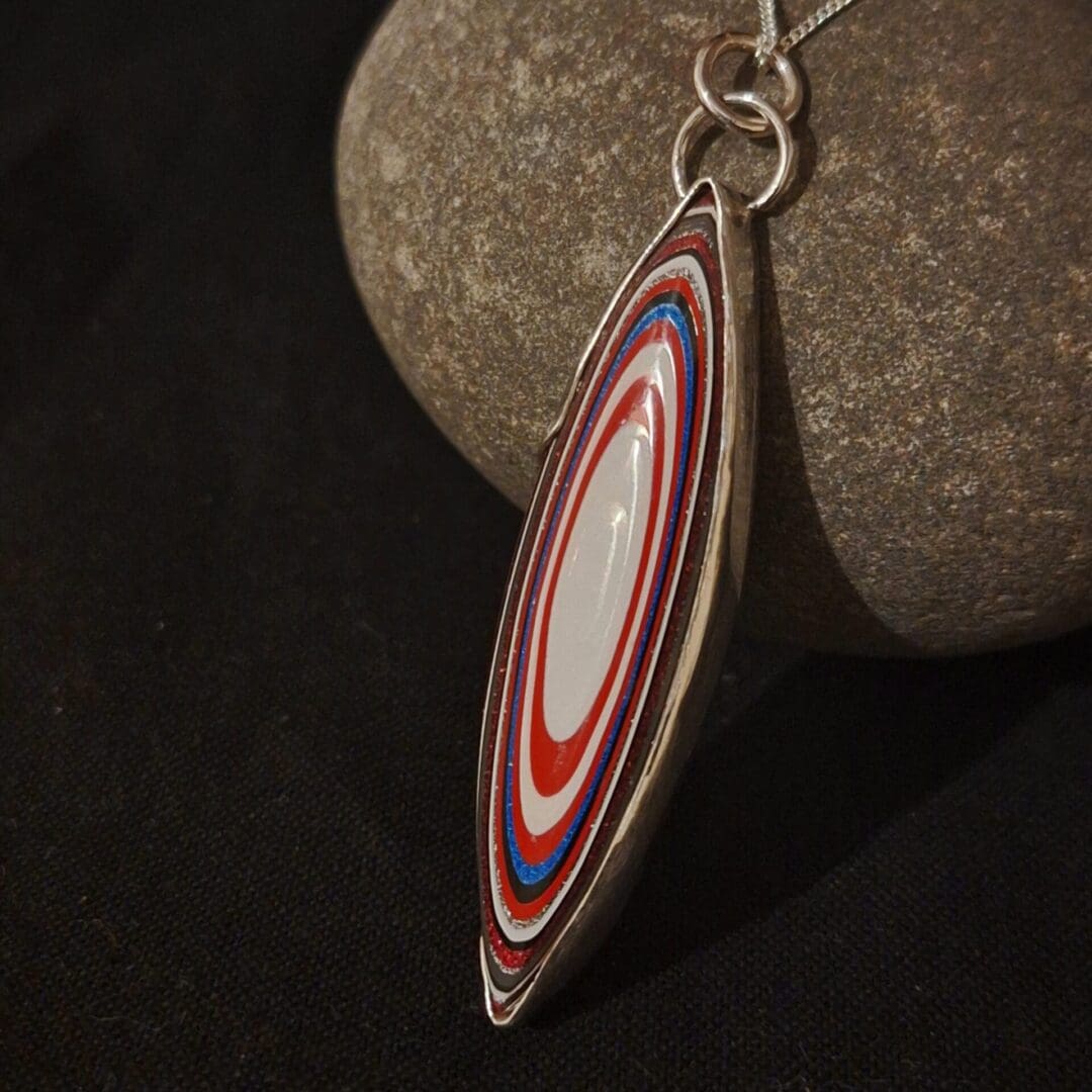 Fordite and Silver Pendant