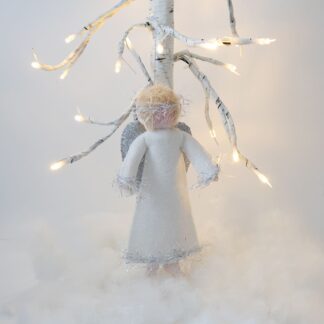 Christmas tree angel decoration in white felt hanging on white twig tree with small lights