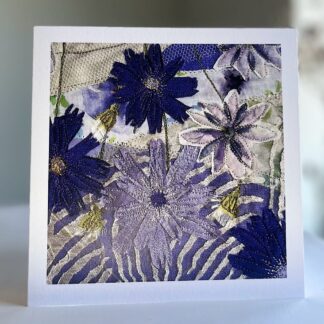 Purple cornflowers made from embroidery printed on a greetings card