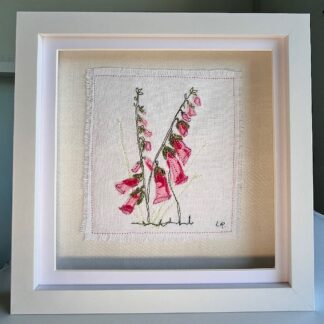 Box frame with a delicate embroidery of two pink foxgloves intertwined