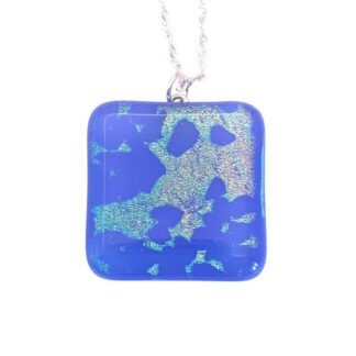 Square handmade blue glass pendant with shimmering holographic accents, hanging from a silver chain.