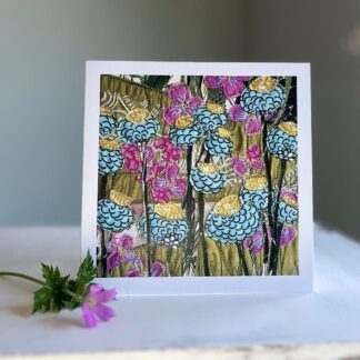 Print of floral textile art on greetings card with flower, standing on table