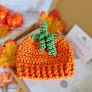 Handmade crochet pumpkin baby hat with curly green stalk, autumn and Halloween gift for newborn to 6 months