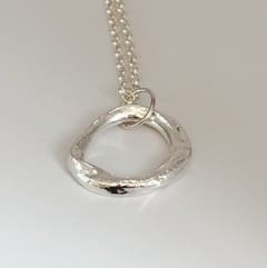 Sterling silver oval shaped molten pendant