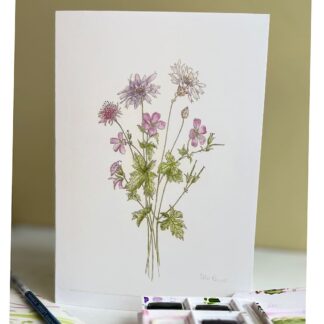 card with a bouquet of flowers on the front with a box of watercolour paints