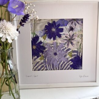 Framed textile art of purple and lilac cornflowers