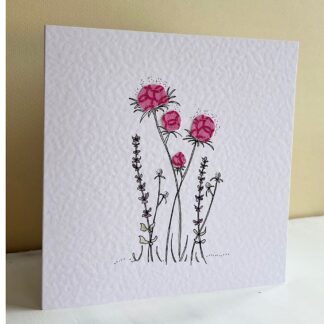 White greetings card with ink drawing of flower with applique fabric flower heads