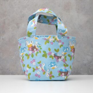 Toy tote bag in blue with print featuring baby birds