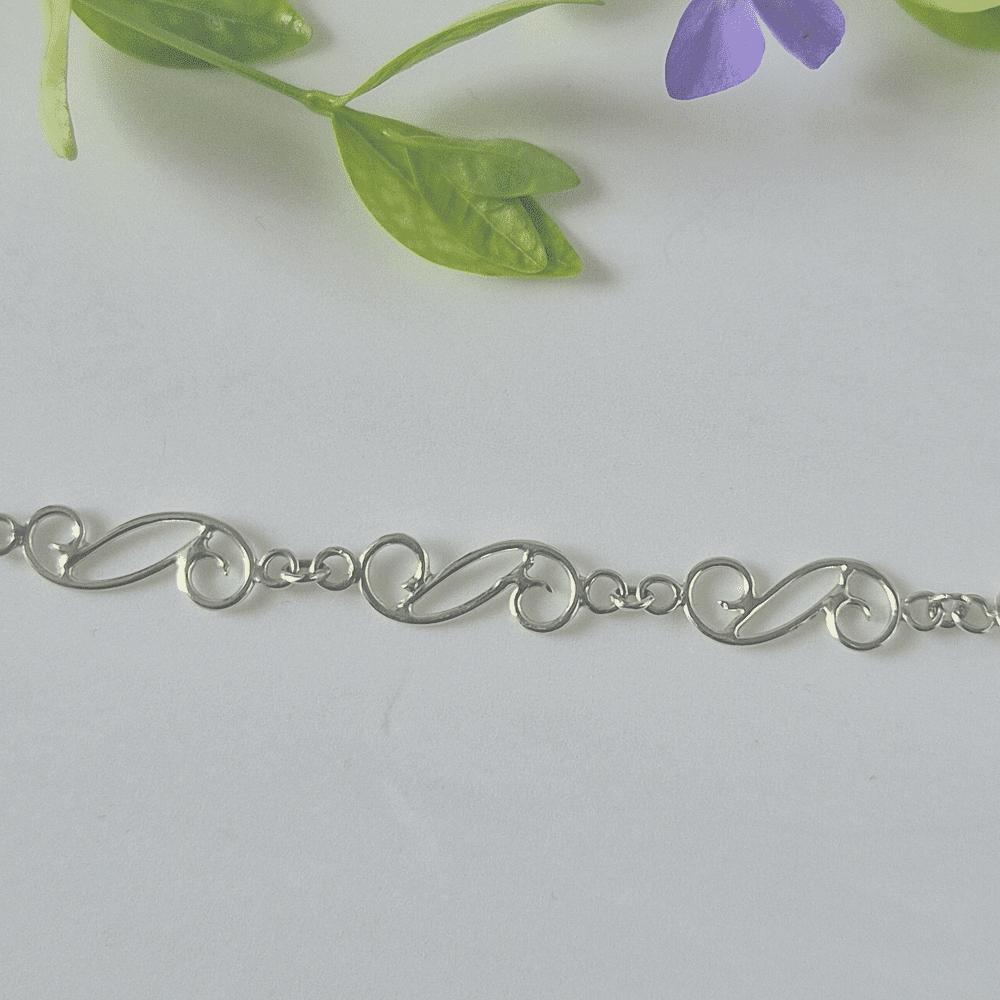 Closeup of the spiral links in the sterling silver bracelet.