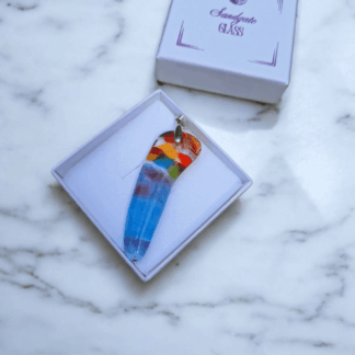 Rainbow fused glass pendant necklace on a silver plated chain, handmade multicolour art glass jewellery displayed in a white gift box