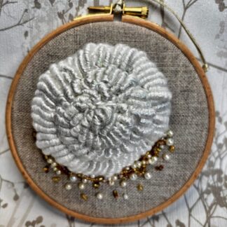 5" embroidery hoop with a white seashell