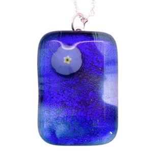 An elegant blue dichroic glass pendant with a subtle flower design at its center, hung from a delicate silver chain.