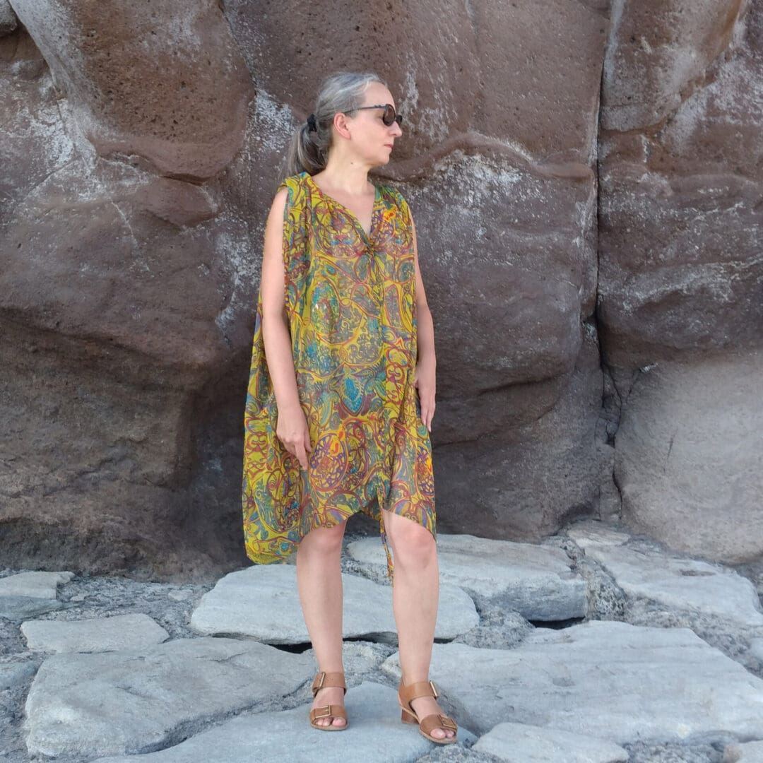 woman wearing beach tunic dress in yellow and blue