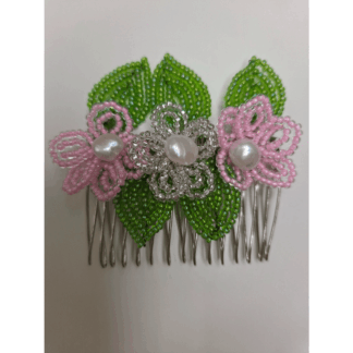 Picture is a silver coloured comb clasp with 2 light pink, 1 crystal and 5 french beaded leaves