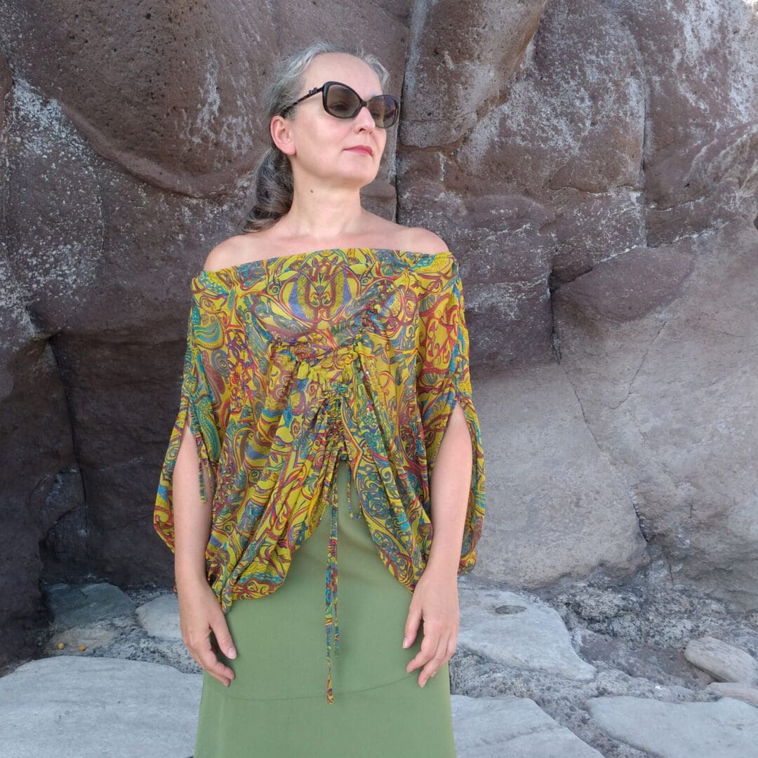 woman wearing off shoulder top in Grecian style