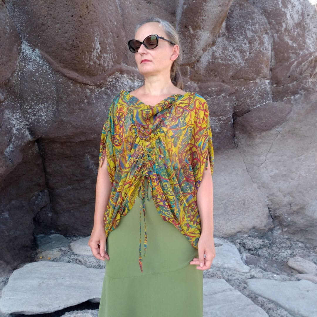 woman wearing grecian style tunic top with cowl neck
