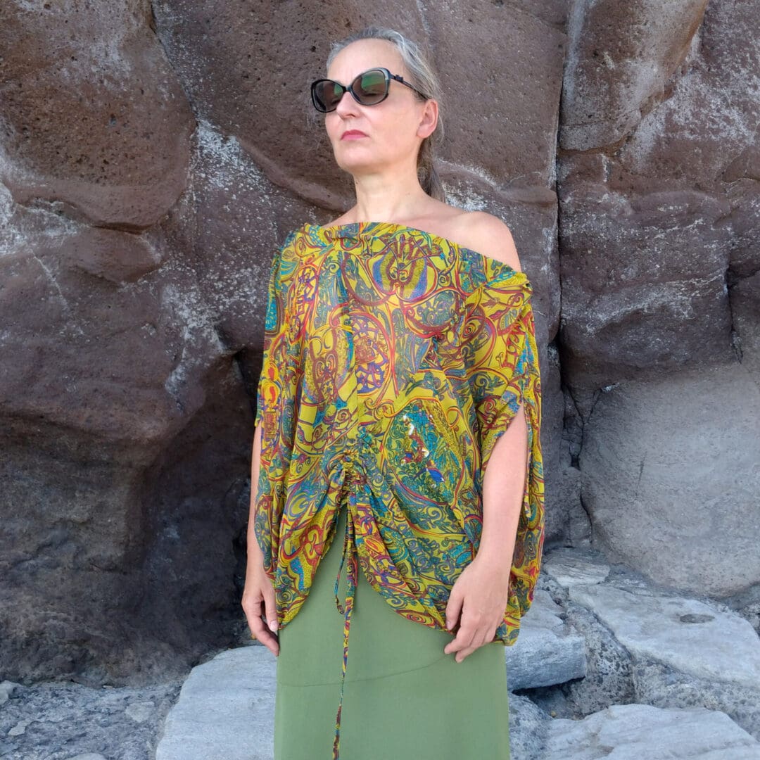 woman wearing off shoulder top in yellow and blue