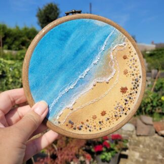 Hand embroidered shoreline on a watercolour wash. 6 inch embroidery hoop wall hanging.