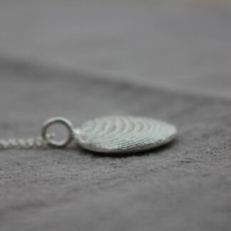 cuttlefish cast pebble in sterling silver. Gorgeous natural texture. hung on a belcher chain