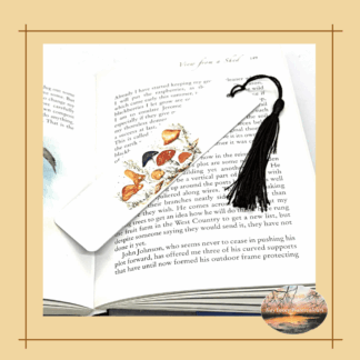Aluminium bookmark with Fungi artwork displayed in book