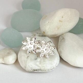 Fine silver star flower stud earrings with sterling silver posts and butterfly fastenings