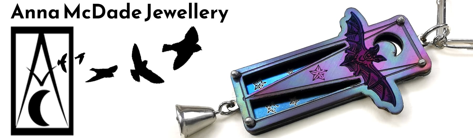 titanium bat pendant on white background with anna mcdade logo