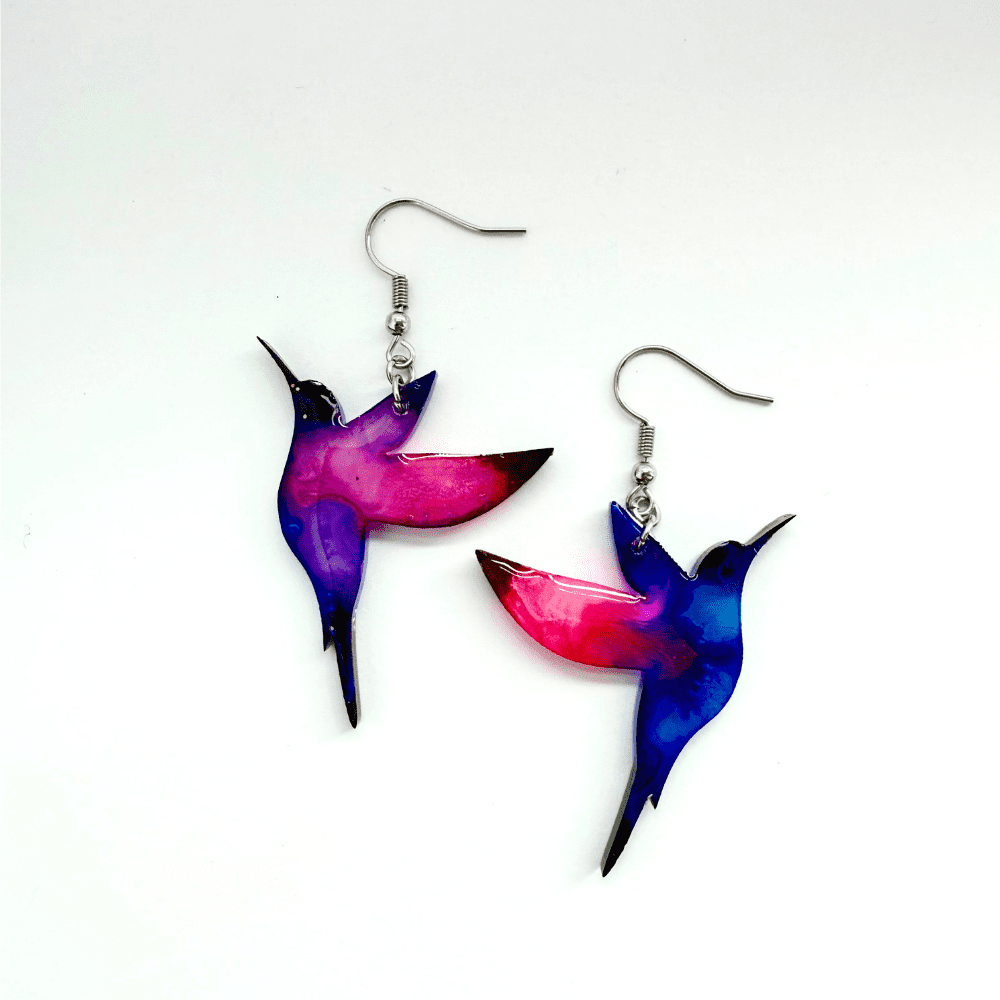 Nature-inspired handmade earrings with flying hummingbird silhouettes