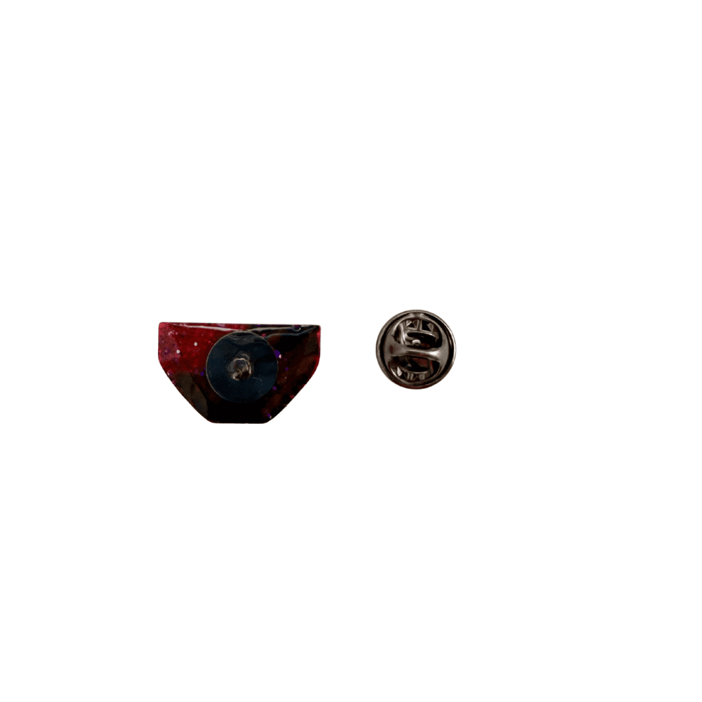 Image showing the pin badge and back of the pink glittery positive pants pin
