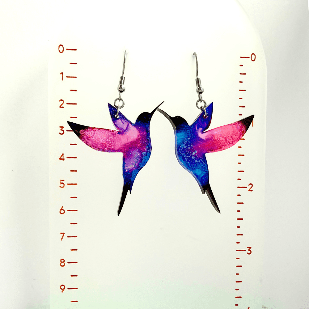 Pair of handmade pink and blue hummingbird earrings with hypoallergenic hooks