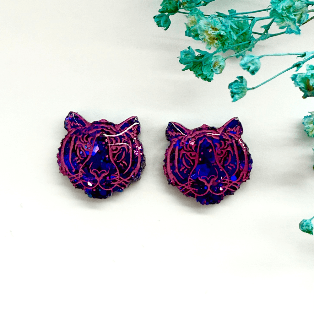 Tiger head stud earrings with colourshift purple and pink glitter finish