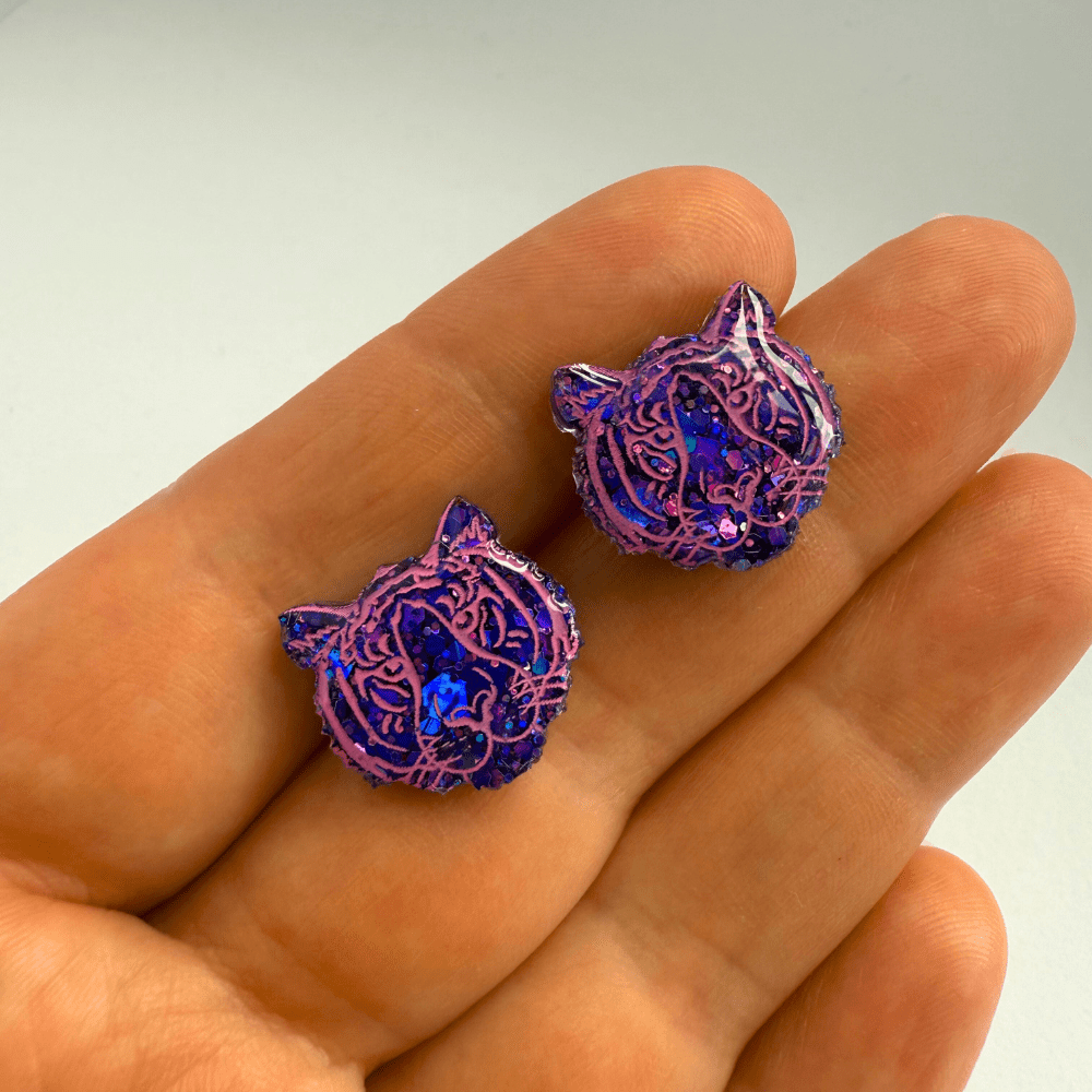 Animal motif resin earrings shaped like tiger heads on surgical steel posts