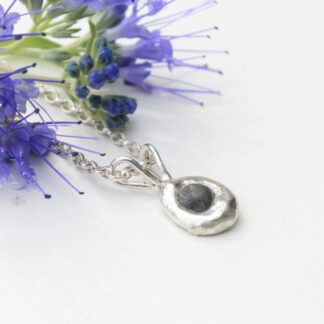Molten silver and raw sapphire necklace