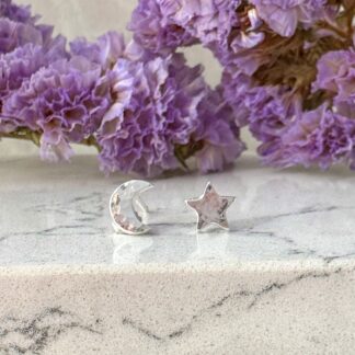 Silver moon and star earrings with a hammered texture