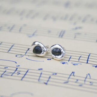 Molten silver earrings with raw sapphires