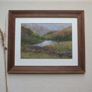Autumn trees and russet bracken sweep down hillsides to a bend in the river. Viewer is looking over a dry stone wall to sheep grazing in a field.
