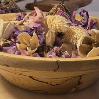 Hand-turned spalted beech potpourri bowl filled with dried botanicals and petals, showing the natural spalting and smooth oiled finish.