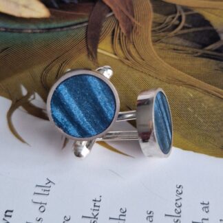 Handmade sterling silver round cufflinks, inlayed with polymer clay, in shades of petrol lyons blue with a satin finish