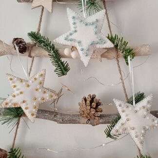 Beaded felt star trio gold light blue and silver by lyndawilcansew hung on a rustic winter tree branch