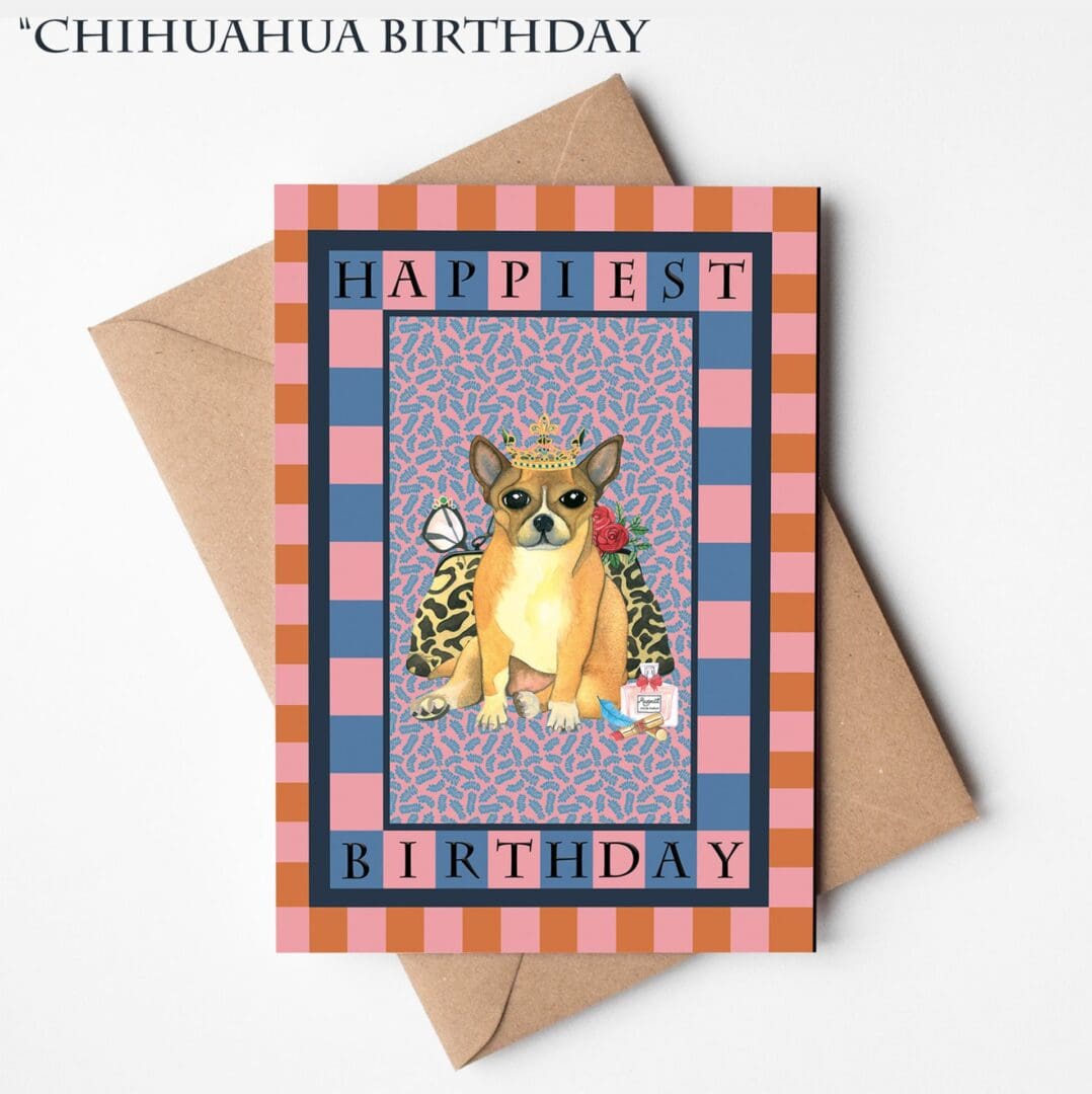 A hand-illustrated birthday card featuring a crowned chihuahua wearing a spotted coat with the words “Happiest Birthday,” displayed on a natural brown Kraft envelope.