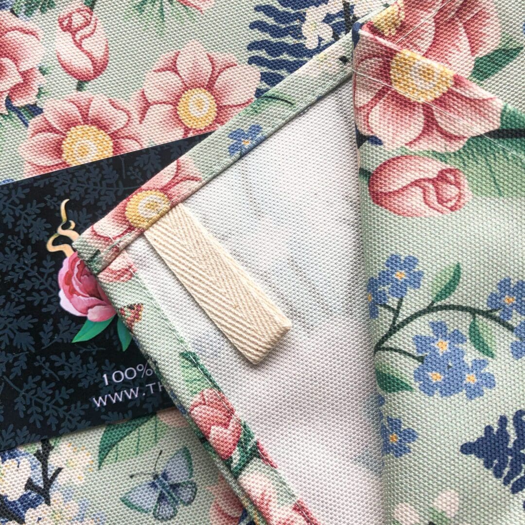 Cotton chinoiserie tea towel with corner hanging loop, printed in the UK with eco-conscious inks.