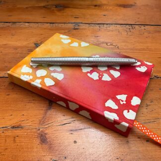 A6 plain paper handmade notebook covered in Batik style fabric