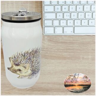 Cab style drinks bottle with hedgehog artwork beside a keyboard