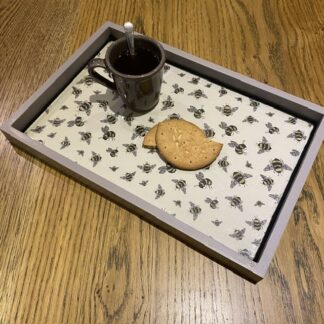 A hand decorated rectangular wooden tray. A pretty bee design.