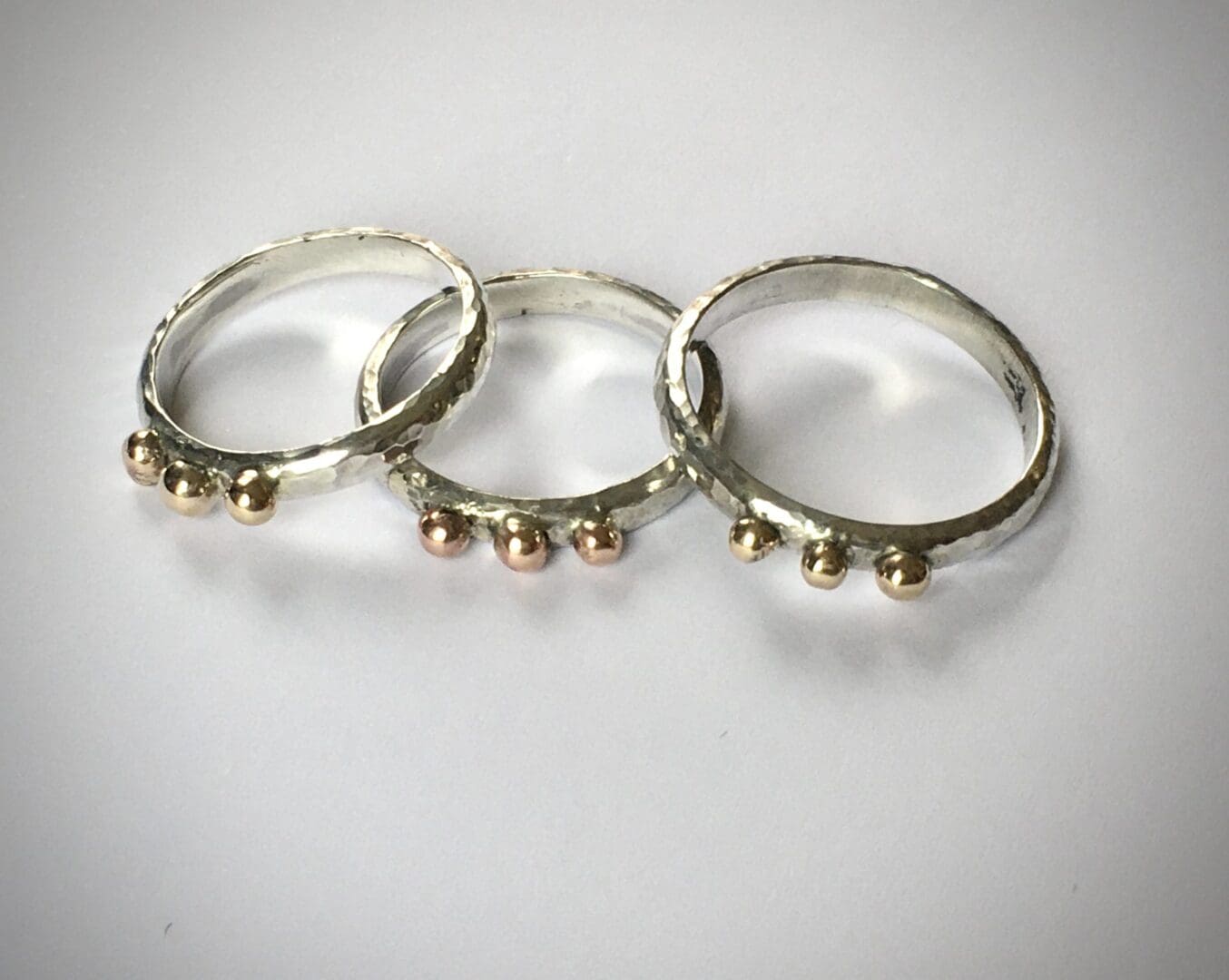 Silver rings with gold balls