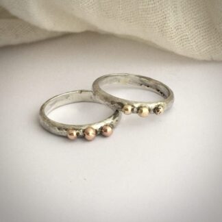 Silver rings with gold balls