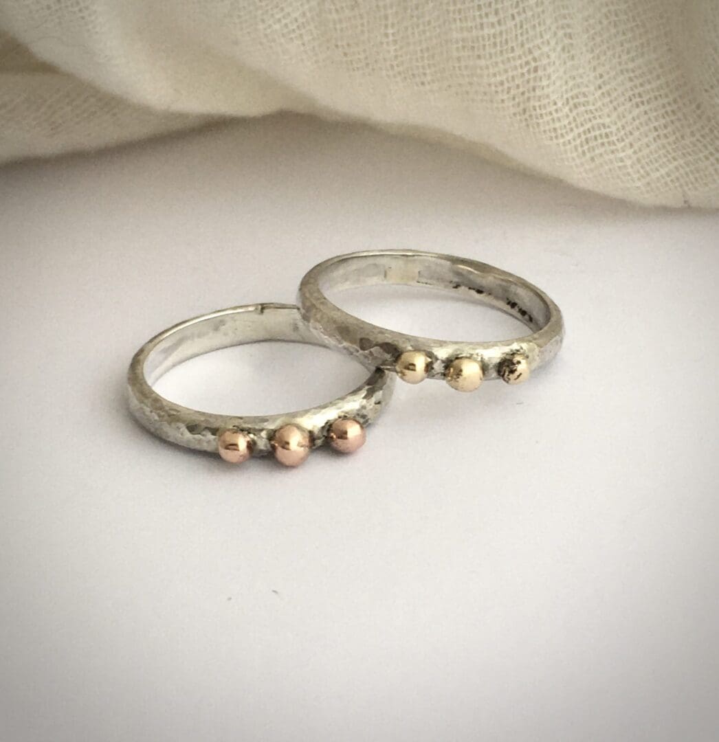 Silver rings with gold balls