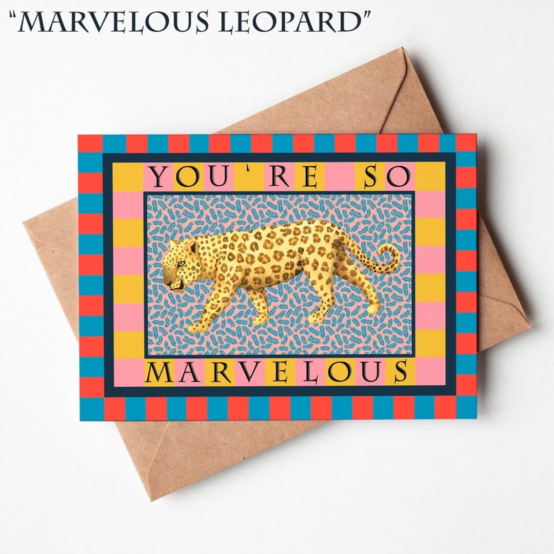 A hand-illustrated greeting card featuring a leopard walking across a patterned background with the words “You’re Marvellous,” resting on a natural brown Kraft envelope.