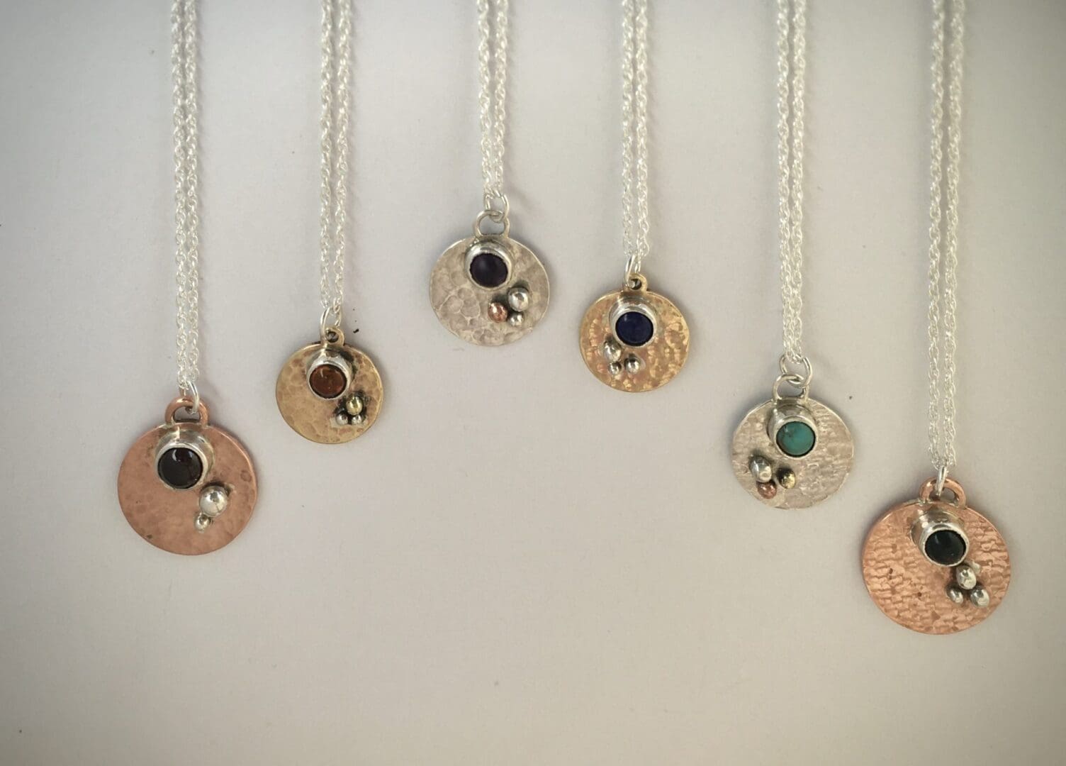 Round pendants with stones